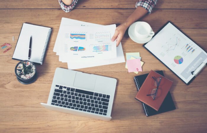 Top view of young Businessman woman hands reviewing analyzing f