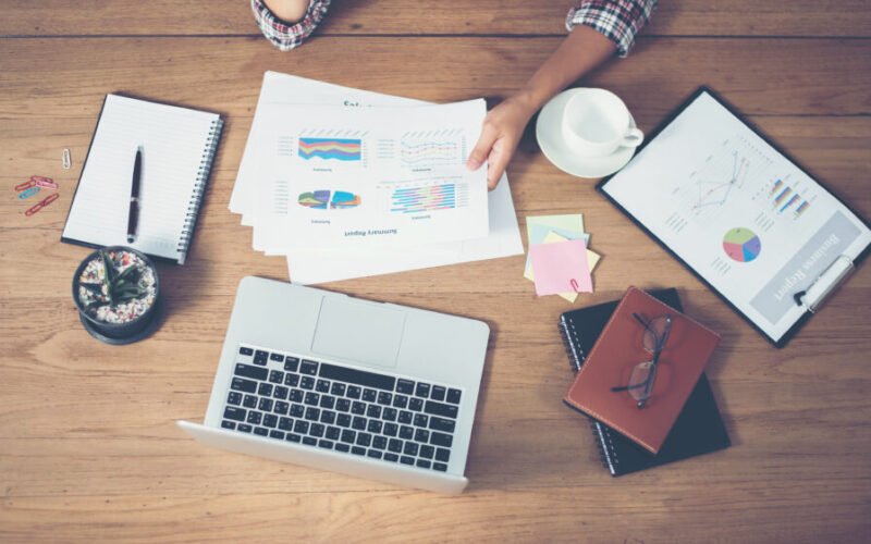 Top view of young Businessman woman hands reviewing analyzing f